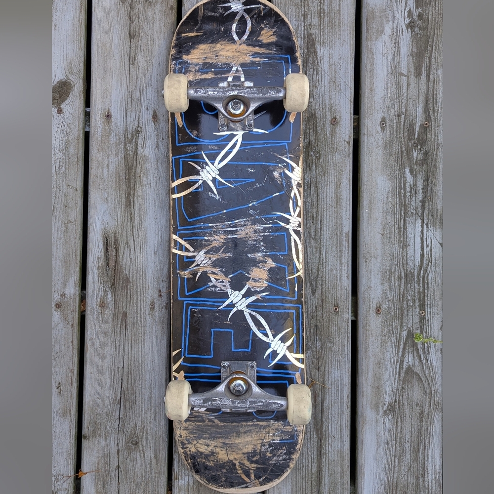 Black and Blue Skateboard with Graphic Design